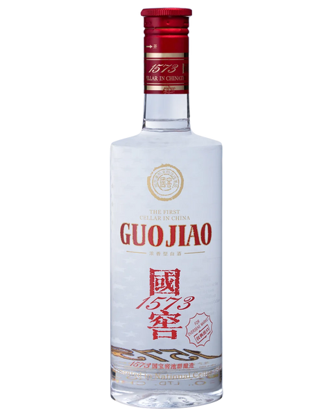 A bottle of Guojiao liquor with a clear glass body, white label, red cap, and red and gold printed text and logos, shown on a plain white background.