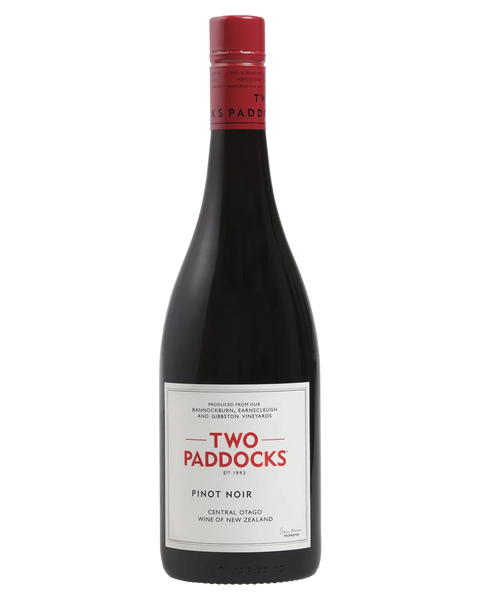 A bottle of Two Paddocks Pinot Noir red wine, featuring a dark glass bottle with a white label and a red foil seal on the neck, set against a plain white background.