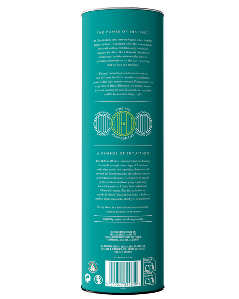 The back of a tall cylindrical canister for Glenfiddich 16 Years Old Aston Martin. Shown against a plain white background. The canister is teal with black text and a green circular logo in the center.